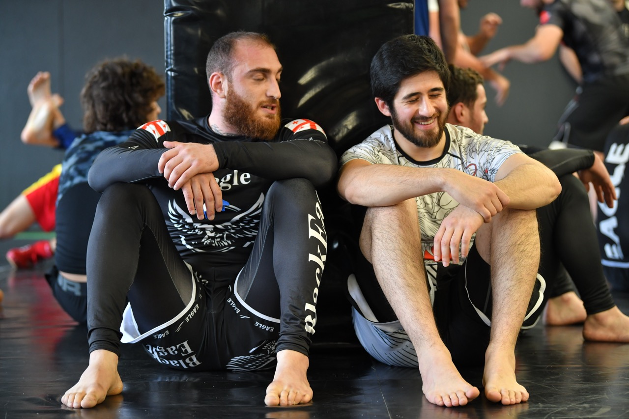 Brazilian Jiu-Jitsu rolling session at the Gymnasia mats