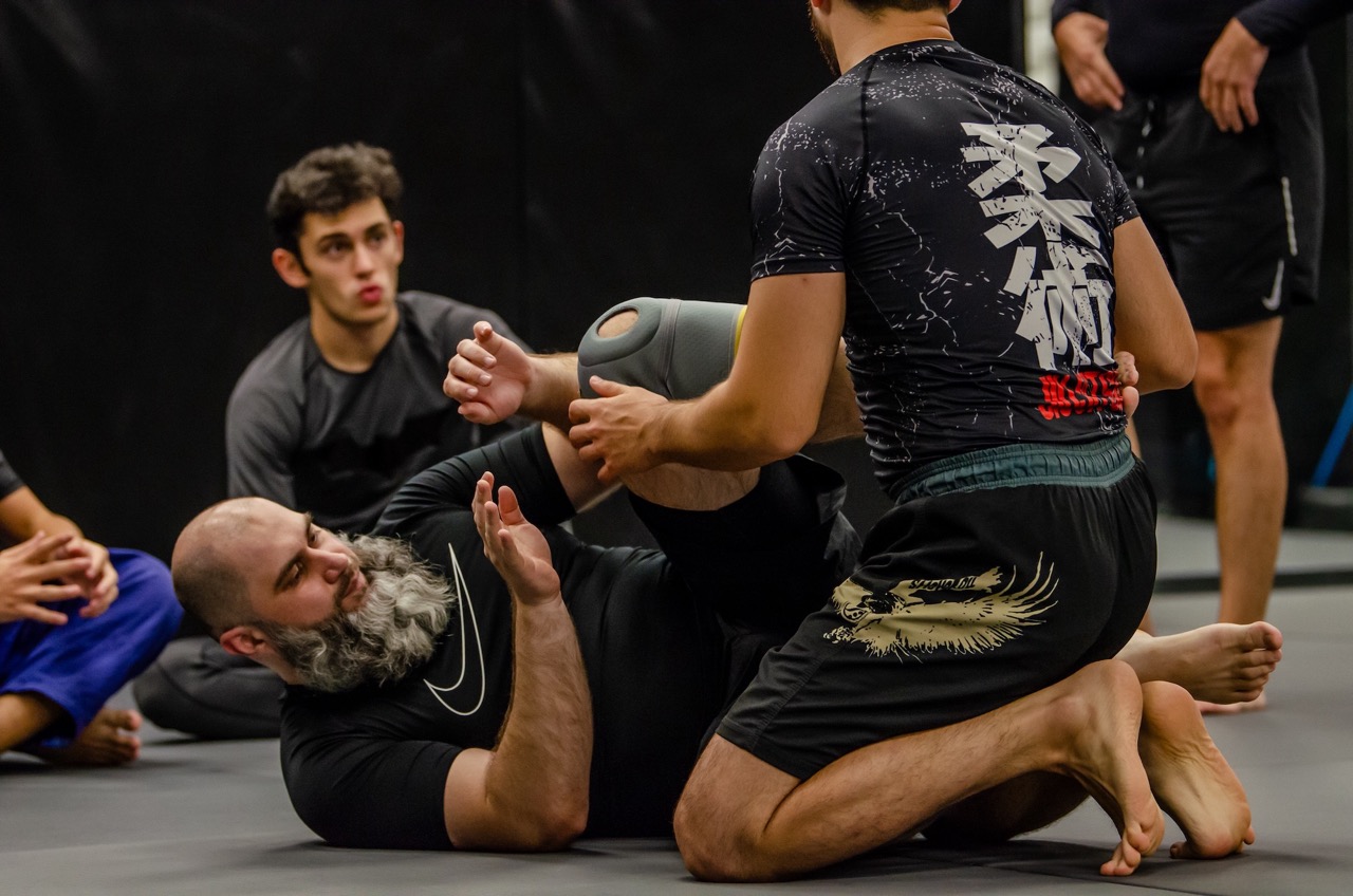 Brazilian Jiu-Jitsu rolling session at the Gymnasia mats