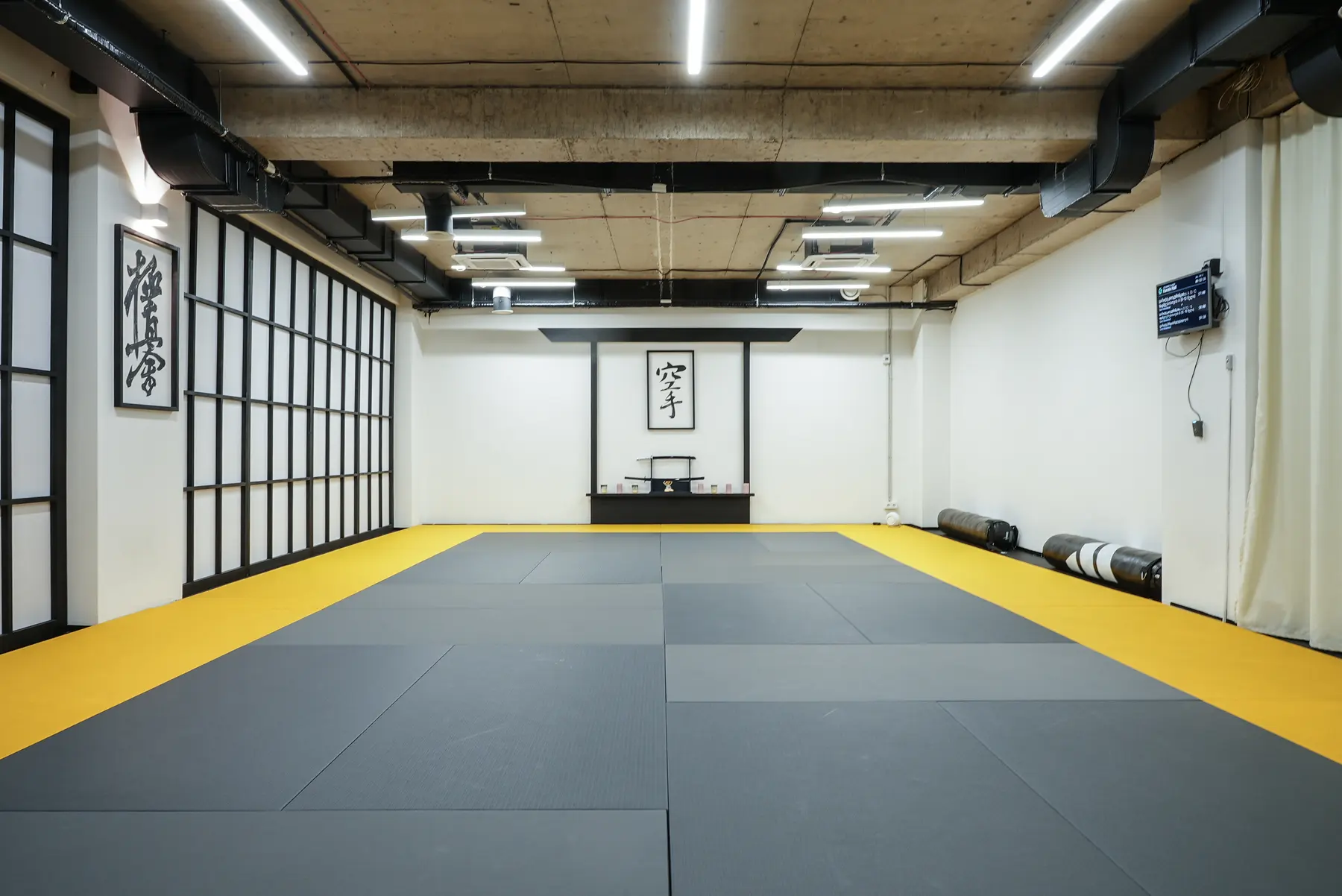The kyokushin dojo at Gymnasia in Tbilisi, with shoji screens and a kamiza