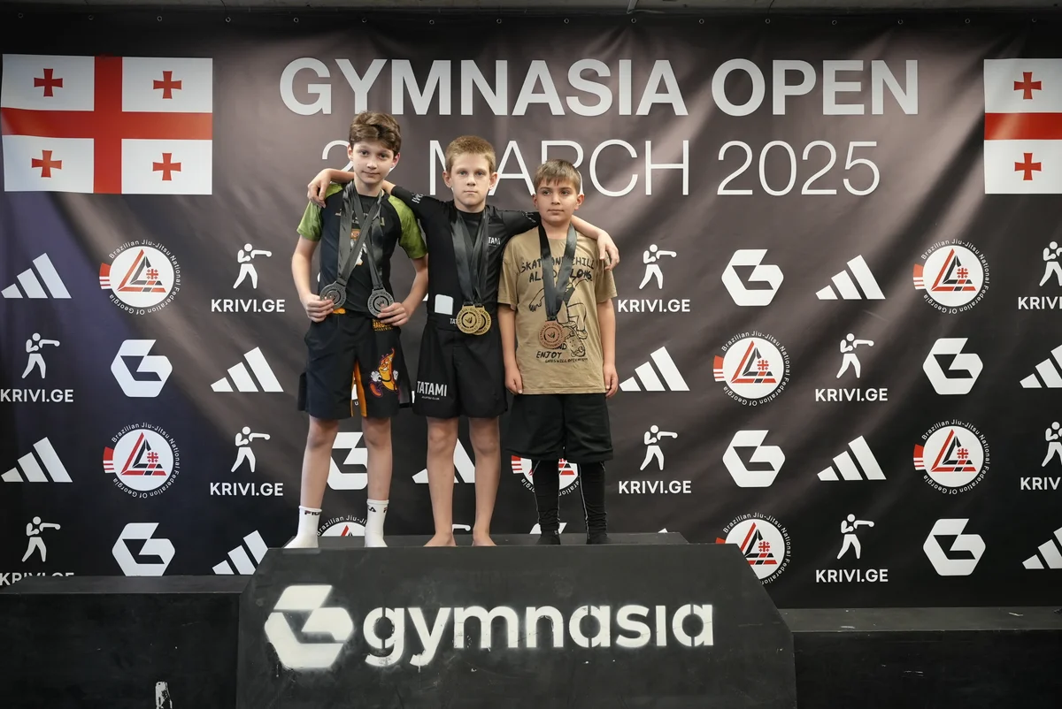 Medal-winning young athletes after a camp competition